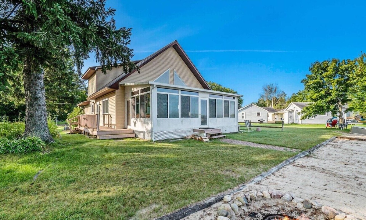 Gaylord House | Marvelous 4-bedroom lake house in Gaylord with sunset views & private beach