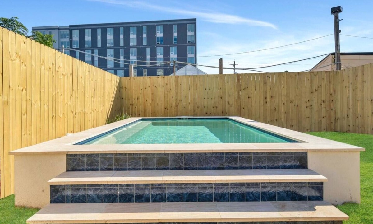 Tulane - Gravier Apartment | Modern 4BR Mid-City home with heated pool & parking. Steps to streetcar, near FQ & parades.