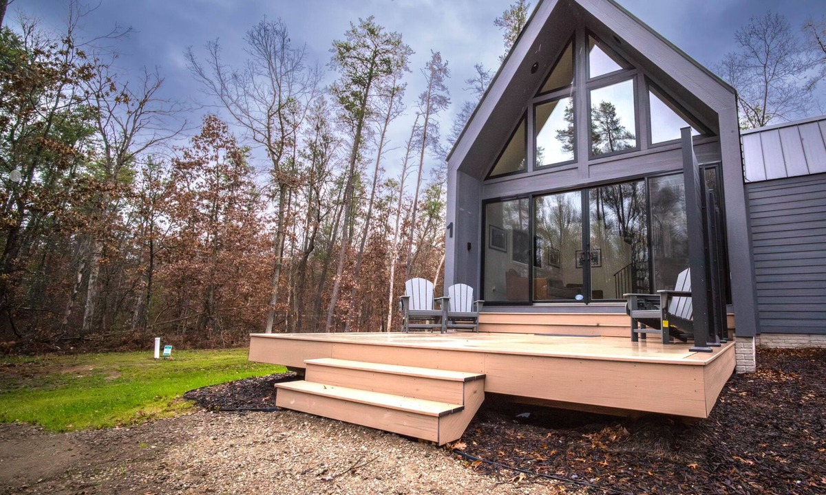 Wellston Ski Chalet | Modern Forest Chalet Sleeps 6 Starlink Rivers & Caberfae Pet-Friendly