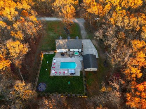 Muskegon House | Pine & Paddle Getaway Game Room Hot Tub Pool