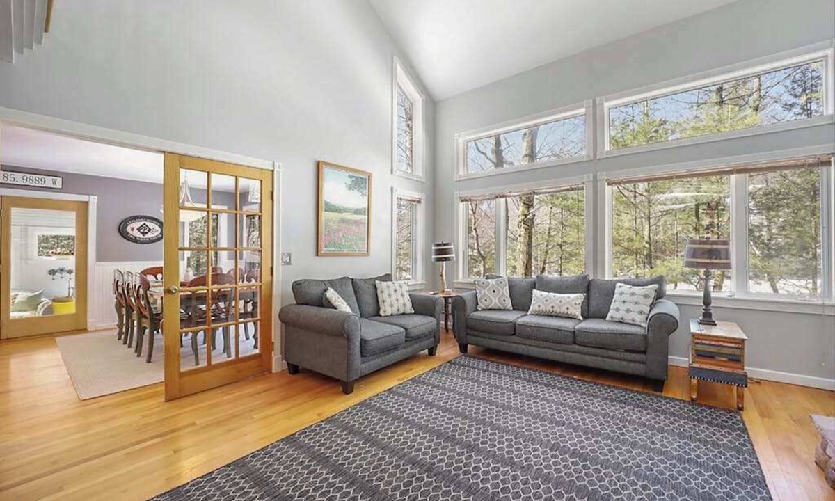 Maple City House | Spacious home with studio, lake access, sunroom, fireplace, W/D, & central AC