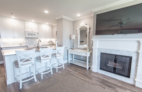 Boyne City Condo | 112 Water Street | Lake Charlevoix Views | Private Patio and Beach |