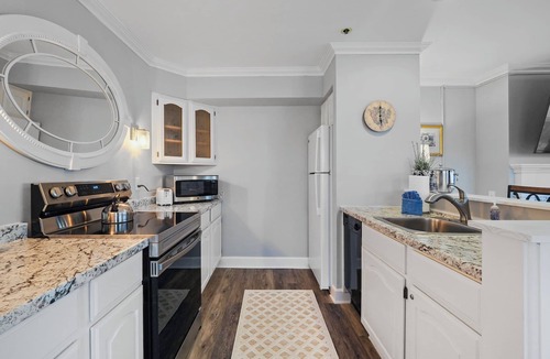 Boyne City Condo | 215 Water Street | Balcony Over Lake Charlevoix | Waterfront Stay | Fireplace