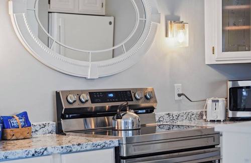 Boyne City Condo | 215 Water Street | Balcony Over Lake Charlevoix | Waterfront Stay | Fireplace
