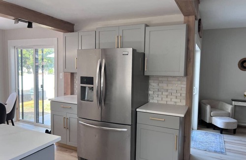 Northeast South Bend House | 5BR retreat with hot tub, fire pit & outdoor TV, walk to Notre Dame, sleeps 12