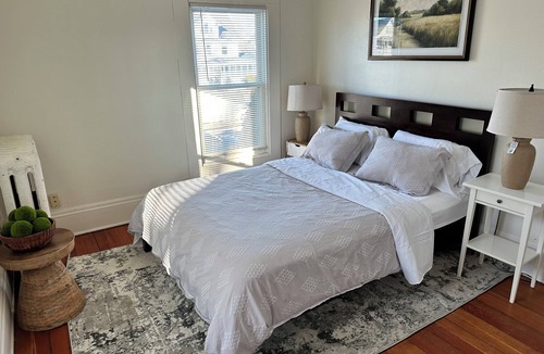 Summit - University House | Bright, cozy & cute in St. Paul by Summit-University with porch and swing chair
