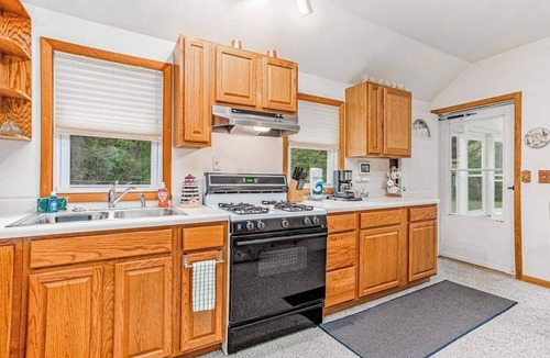 Lakeside House | Charming home with sunroom, large yard, full kitchen, & washer/dryer