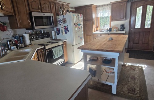 Escanaba House | Comfortable 3-bedroom 2 bath home with beach on Little Bay de noc. Pets welcome!