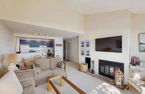Maple City Condo | Condo in Glen Arbor with Lake Michigan sunset views, fireplace, deck, washer & dryer