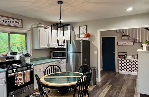 Northeast House | Creek View Farmhouse-Style Home on Acreage