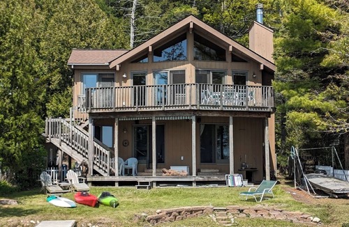 Beulah House | Direct Crystal Lake sandy swimming home. Kayaks, dock, firepit, AC. Dog ok