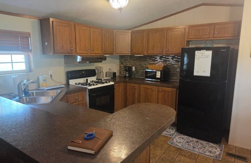 Cisne House | Enjoyable 2-bedroom mobile home with AC in charming Cisne. Quiet neighborhood.
