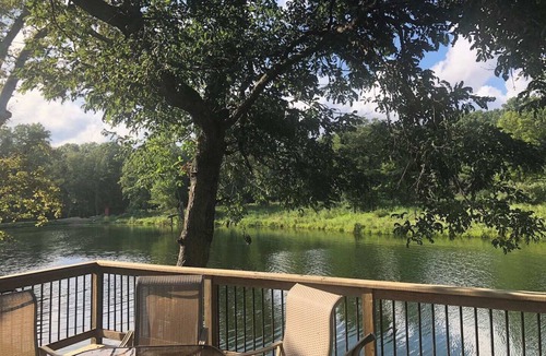 Collinsville House | Escape to a private 3BR waterfront retreat on a 7-acre pond near Route 66. Enjoy peaceful views, a fire pit with seating, fishing dock, and spacious living areas. Perfect for relaxing getaways with easy access to St. Louis attractions.