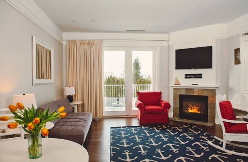 Bay Harbor Condo | Experience luxury at Captain Suite 219 in Bay Harbor, MI, featuring a cozy bedroom and village view.