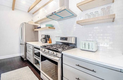 Lakeside House | Fully-renovated lakefront home with beach cabana, association beach, & firepit