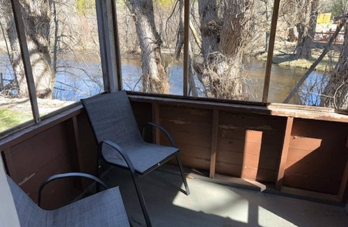 Grayling Cabin | Lovells Riverside Cabin #1 is just steps from the North Branch of the AuSable River with private stair access. You’re also moments from the iconic Lovells Riverside Tavern.