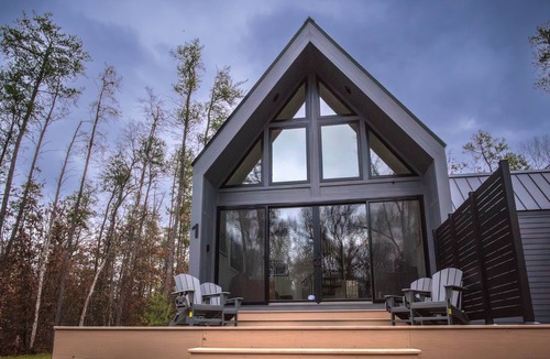 Wellston Ski Chalet | Modern Forest Chalet Sleeps 6 Starlink Rivers & Caberfae Pet-Friendly