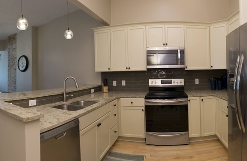 Grand Haven Condo | Newly Renovated Downtown Condo In Historic Fortino's Building