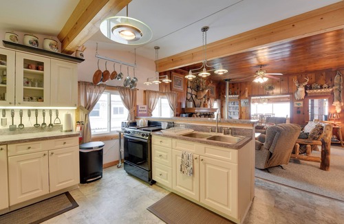 Carp Lake Cottage | Private Dock & Views! Family Home on Paradise Lake