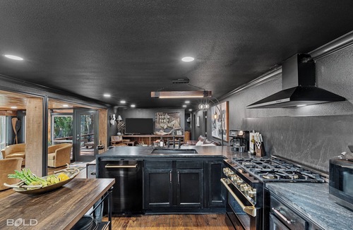 Jefferson Cabin | Relax and unwind at The Whiskey Barrel, a cozy waterfront retreat designed for fun and laid-back lake living. Soak in your private hot tub, paddle out with the kayaks, or spend the afternoon on one of the 4 decks reading a good book