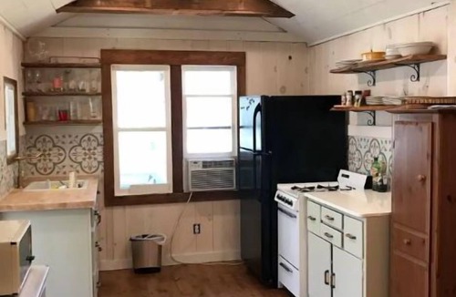 Ludington Cottage | Remodeled lakefront cottage w/marina, firepit, swimming area.