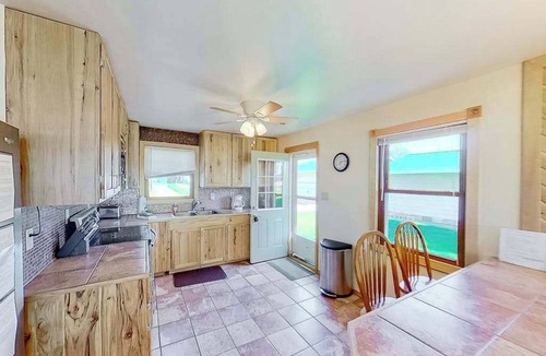 Onekama House | Remodeled, waterfront home on Portage Lake with dock & firepit - 2 dogs OK