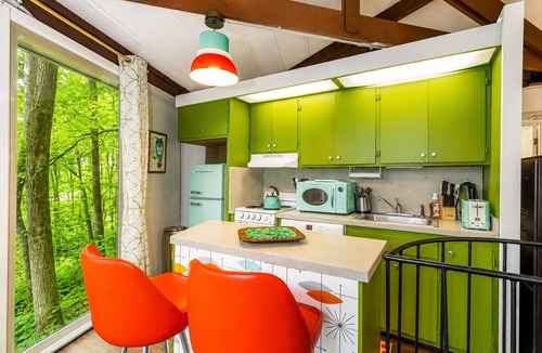 The Galena Territory Cabin | Retro Nest octagon home in woods, pool, jukebox, phonebooth