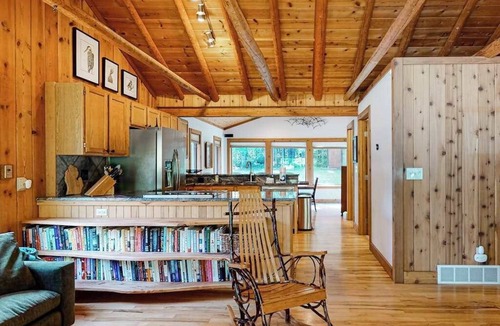 Beulah House | Riverside wooded home with outdoor hot tub, fire pit, gas grill & WIFI