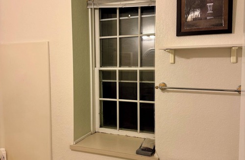 Spillville Apartment | Room 1: Sleep Where Prohibition Secrets Were Made - Historic Escape!