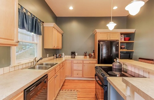 Saugatuck Villa | Screened porch pt water views hot tub walk to Saug