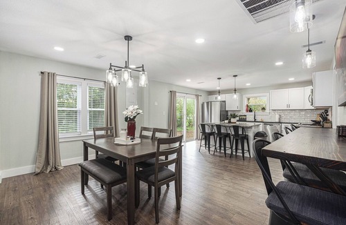 Grandview House | Secluded ½-acre retreat surrounded by trees for ultimate privacy and quiet. Remodeled and beautifully furnished with modern finishes. Enjoy a peaceful setting just 8 minutes from Belton/Raymore—perfect for relaxing stays or extended work trips.