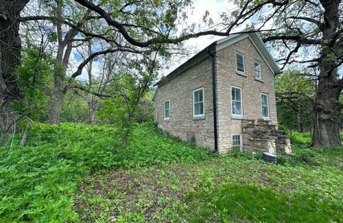 Decorah House | Secluded 1860 Stone House recently remodeled on the Upper Iowa River by Bluffton