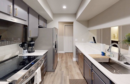 Maple City House | Secluded home with three kitchens, vaulted ceilings, washer/dryer, & patios