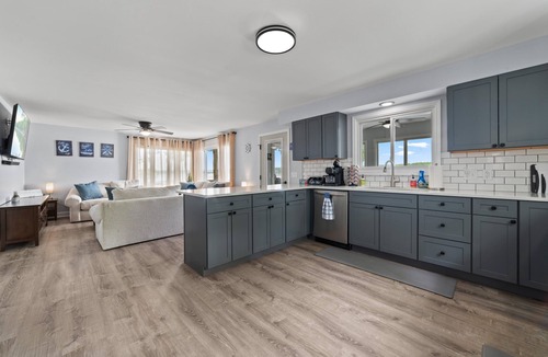 Cheboygan House | Serenity All Year Long : Lakefront 3BR, 3BA retreat with hot tub, dock, kayaks & fire pit.