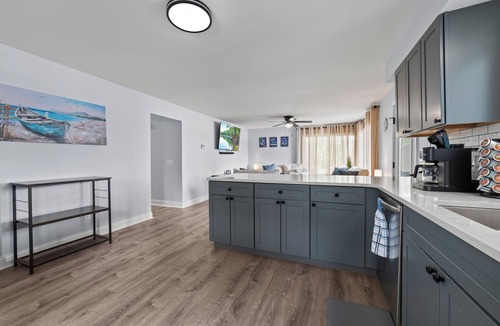Cheboygan House | Serenity All Year Long : Lakefront 3BR, 3BA retreat with hot tub, dock, kayaks & fire pit.