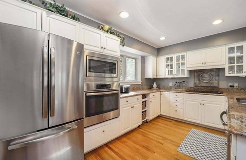 Maple City House | Spacious home with studio, lake access, sunroom, fireplace, W/D, & central AC