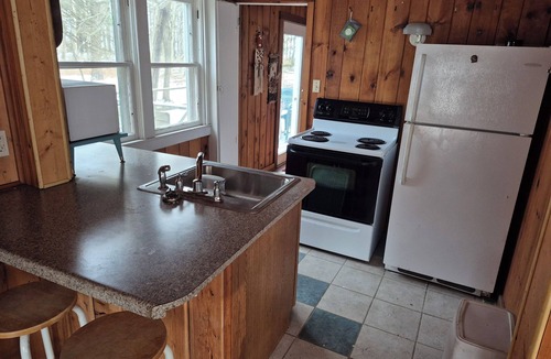 Oostburg Cottage | “Stanley's Cozy Beach Cottage – Steps from the Shore”