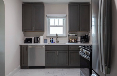 Midway House | The Blue Bungalow: Fully renovated 4BR, 2BA home with cozy Minnesota vibes.