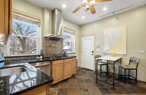 Rogers Park Apartment | This 2 bedroom 2 bathroom elegantly furnished home is ready for all your needs. Featuring a primary bedroom suite, TV room, dining room, and additional sitting areas.