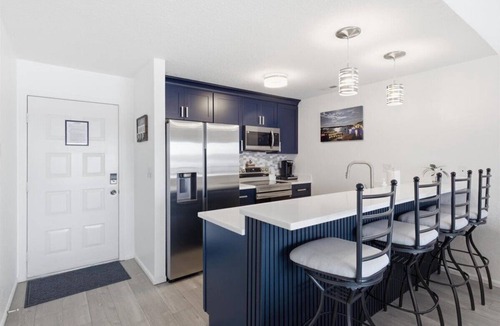 Village of Four Seasons Condo | Top Floor Lake Views, Loft Space & Private Deck Retreat at the 12mm