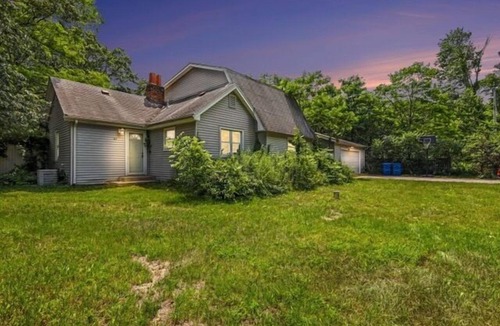 Michigan City House | Welcome to Lake Breeze Cottage near Lake Michigan! This 2-bedroom, 2-bath home offers a king and queen bedroom, sofa couch, open-concept living space, and a private back patio for guest enjoyment.