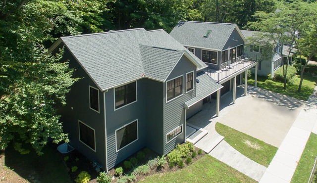 AMAZING NEWER HOME WITH LAKE VIEWS, steps away from shops and restaurants.