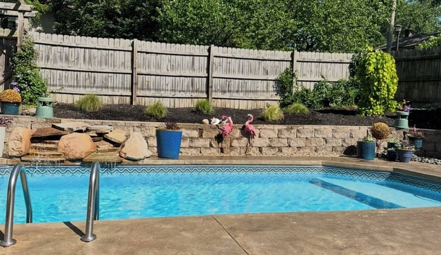 Country Club Plaza area home with swimming pool and outdoor theater