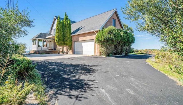 Dog-friendly, lake view home with three season room, fireplace, video projector
