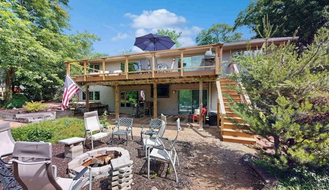 Green side smart home with golf, beach/lake access, off-site dock & EV charger
