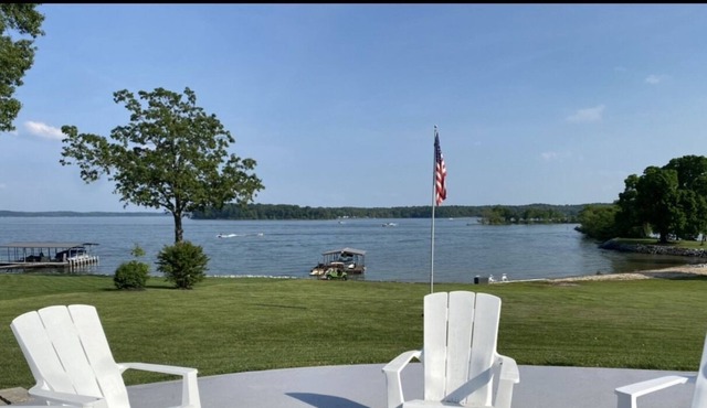 Lakefront with gentle slope to waters edge with pebble beach.