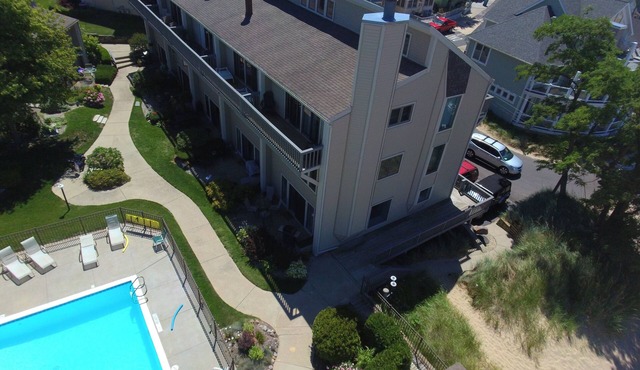 On Lake Michigan with Private Beach & Pool. Walk to Town! Every Window Lakeview!