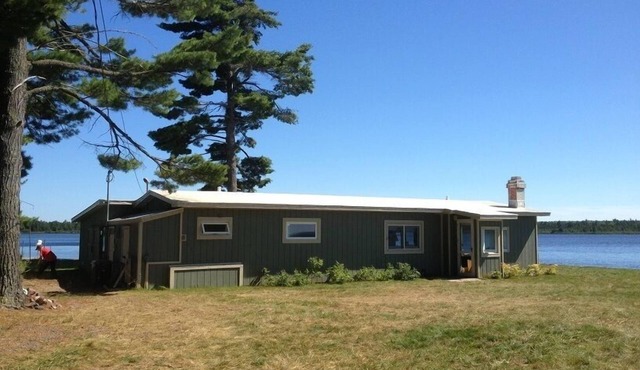 Private Lakefront, spectacular views, water on both sides, deep water dock.