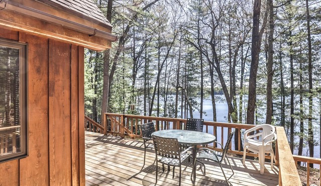Private lakeside cabin on the shore of Virgin Lake with a large deck and firepit in Three Lakes