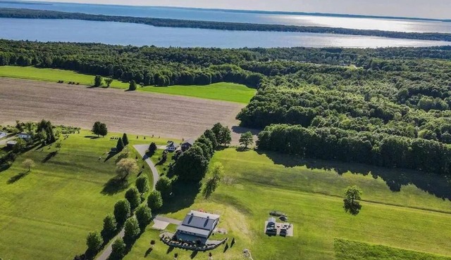 Sleeps 13, Soak in hot tub overlooking Torch Lake and Lake Michigan